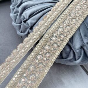 Close-up of luxury zari lace with gold threadwork